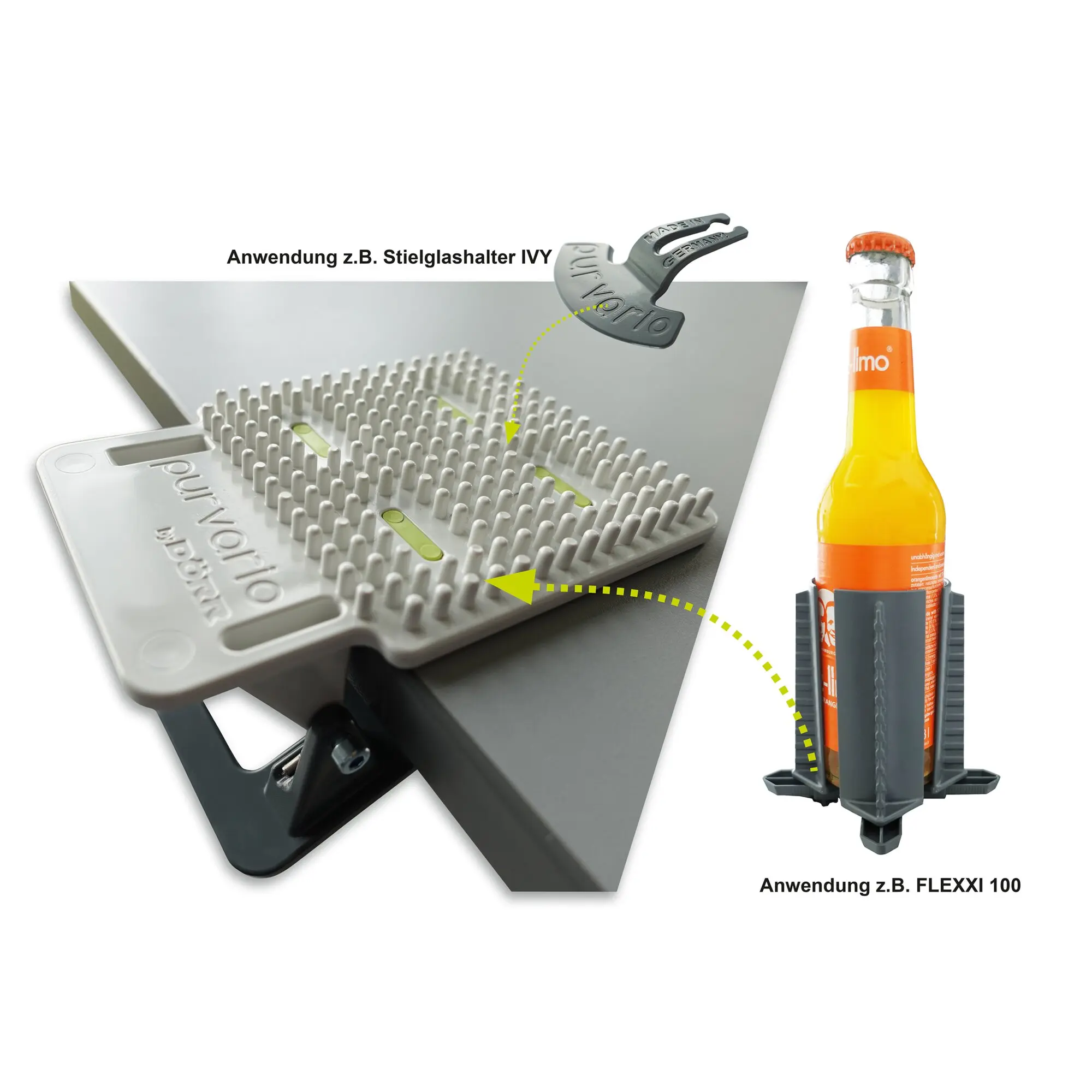 Grauer Clip-Clap Getränkehalter zum Tischklemmen, Prägung Made in Germany sichtbar; rechts eine Glasflasche mit orangefarbenem Deckel