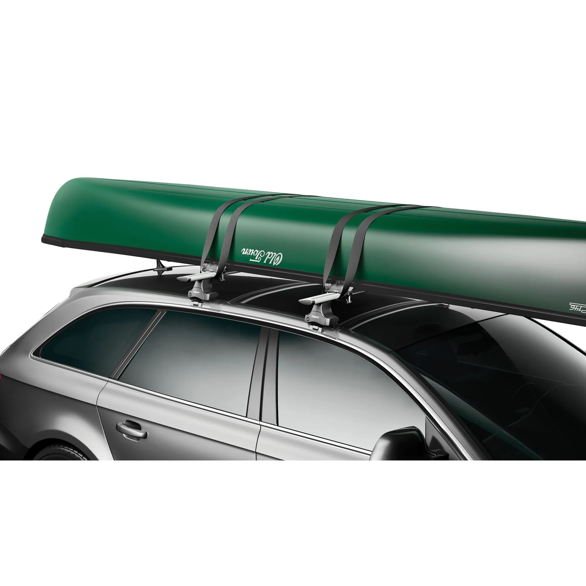 Thule Portage Kanuhalter mit grüner Kanuladung, befestigt mit Gurten auf dem Dach eines silbernen Autos