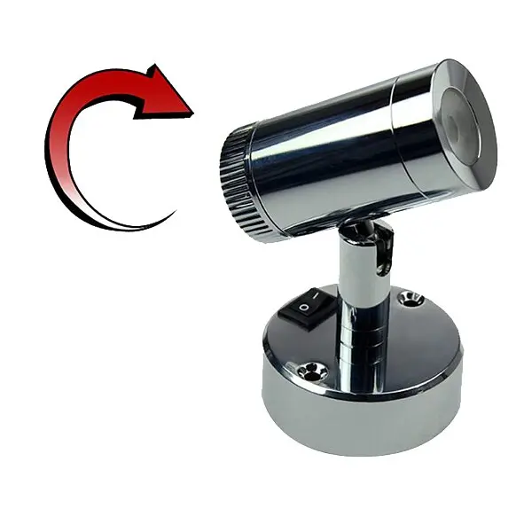 Verchromter Mini-Aufbau-Spot auf runder Basis mit schwenkbarem Arm, LED-Lichtspot, roter Pfeilbogen links daneben und Ein/Aus-Schalter am Sockel