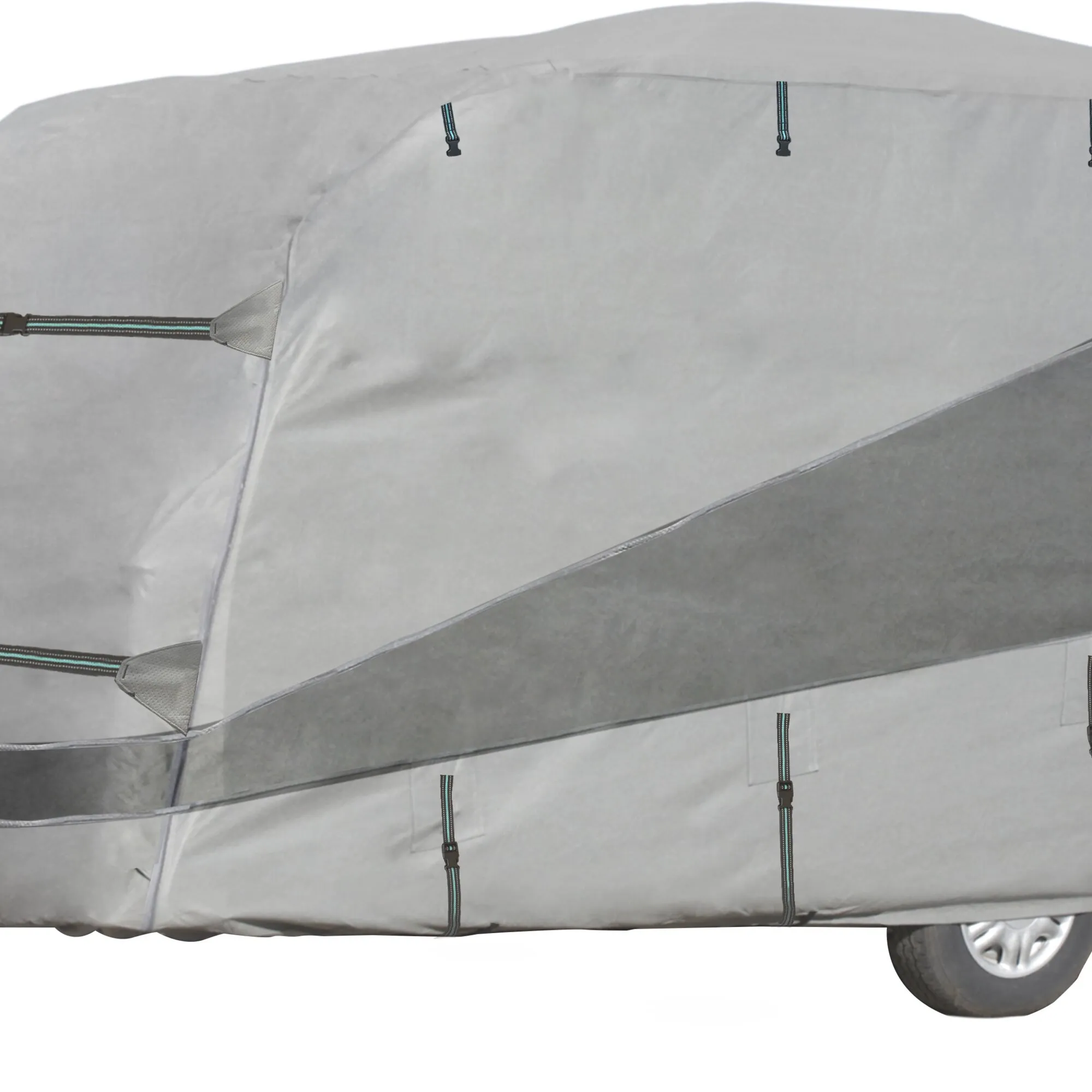 Graue Wohnwagen-Schutzhülle mit schwarzen Zurrbändern und türkisfarbener Naht, über einen Wohnwagen gelegt, Rad unten rechts sichtbar