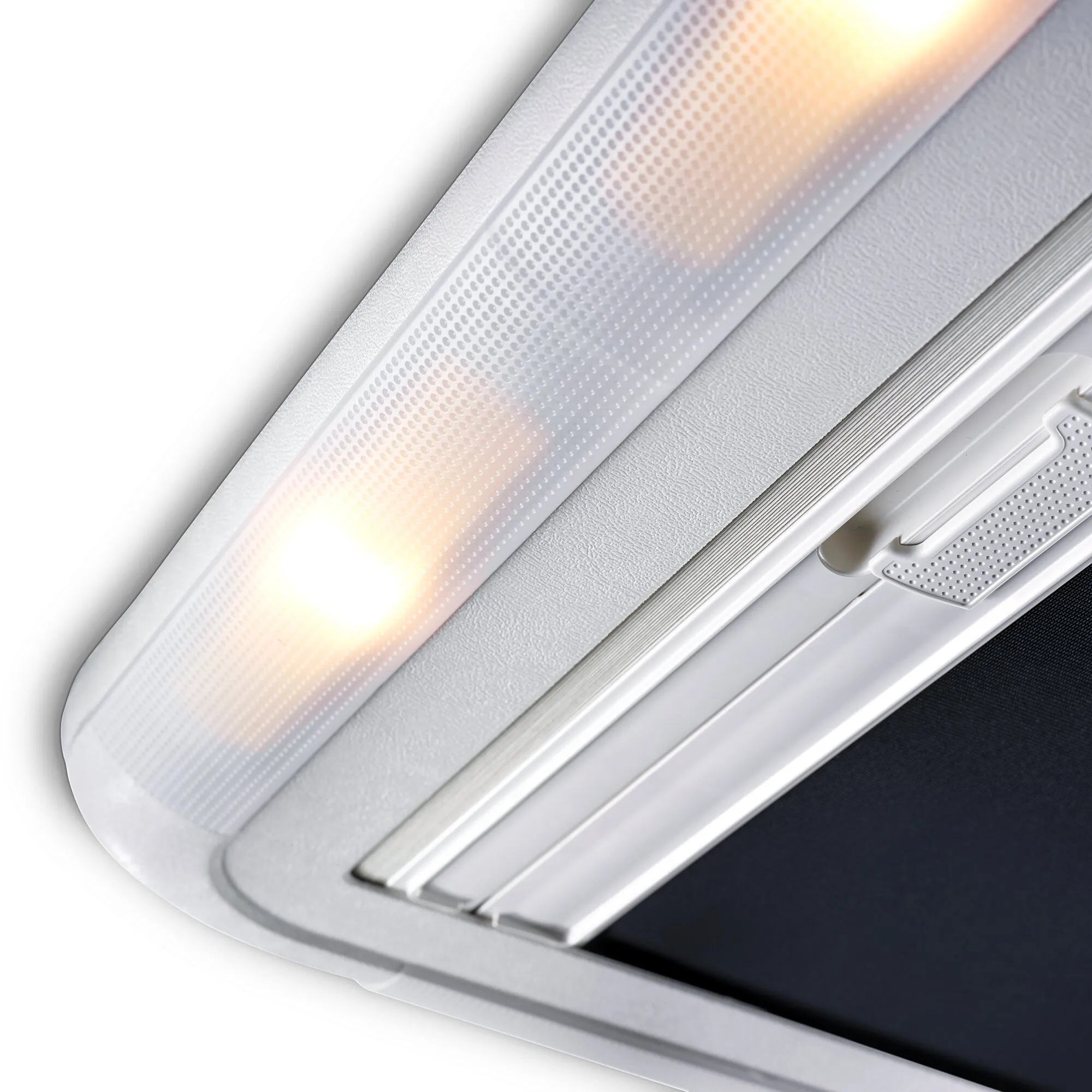 Detailansicht des weißen Dachfensters Heki 2 de Luxe mit perforiertem Innenrahmen, Plissee und integriertem Griff